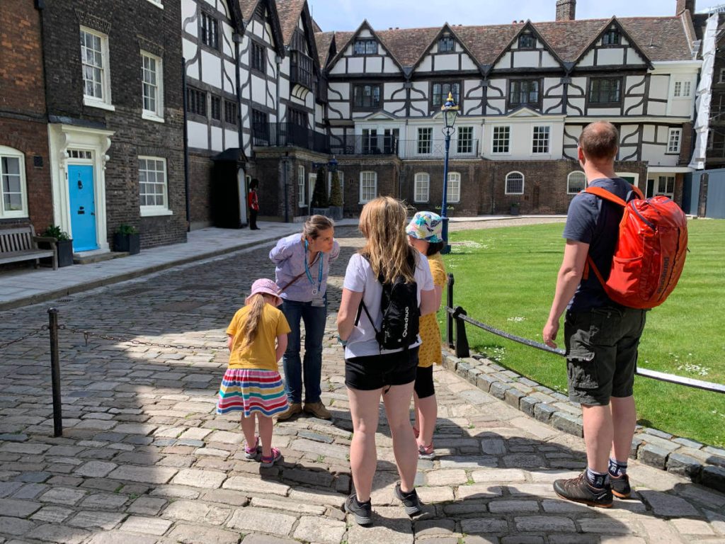 Tour guide leading family tour at the tower of london