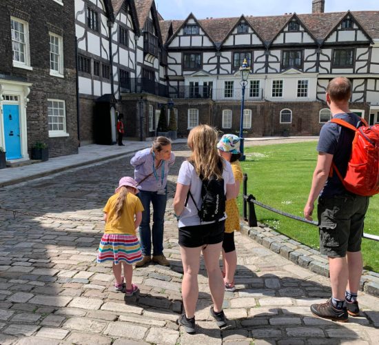 Tour guide leading family tour at the tower of london